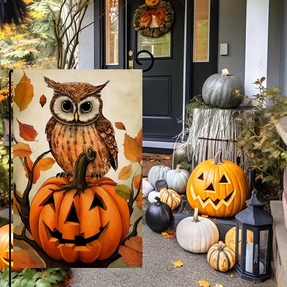 Halloween garden flag featuring an owl sitting on an orange pumpkin