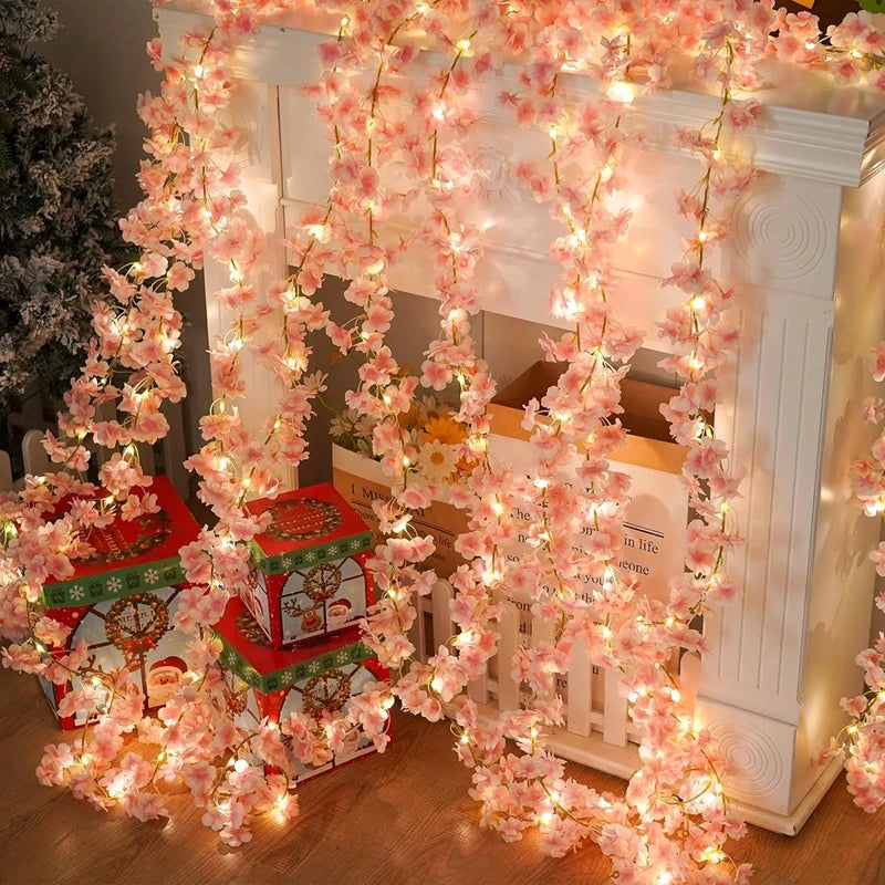 Pink artificial cherry blossom vine draped as romantic room decor