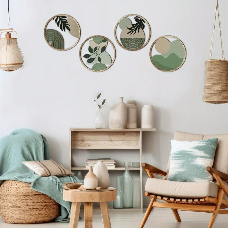 Four sage green botanical wooden wall panels displayed together above a console table